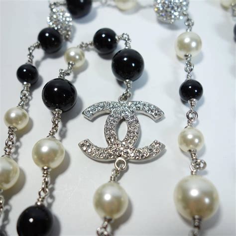 chanel black and white pearls|Chanel long necklace with logo.